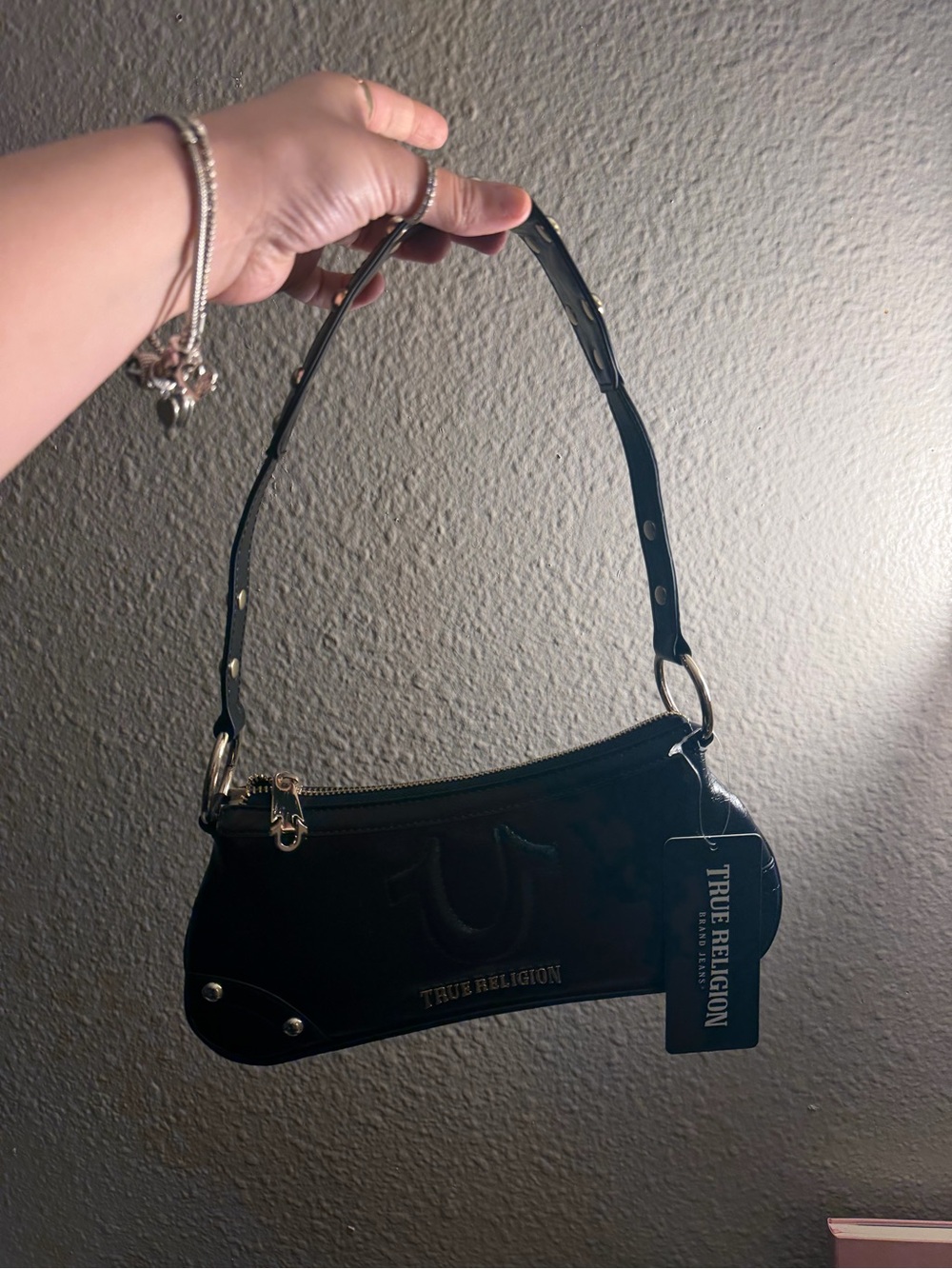 True Religion Black Leather Shoulder Bag with Gold Accents Perfect for the Club